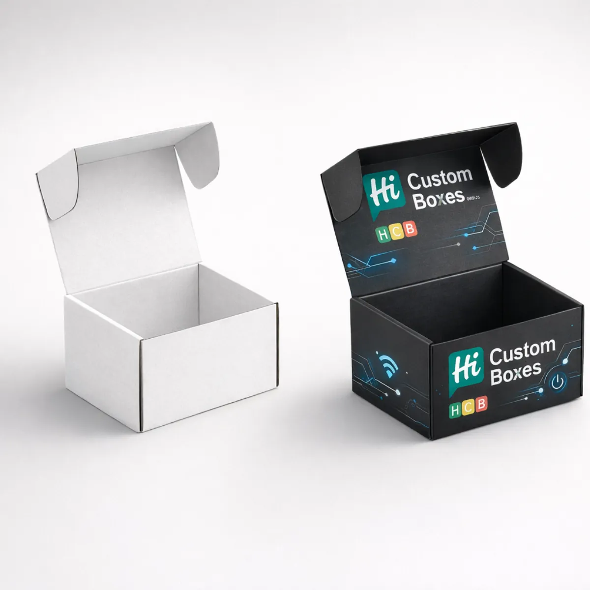 Two small cardboard mailer boxes with open lids, one in plain white and one with black custom branding. class=